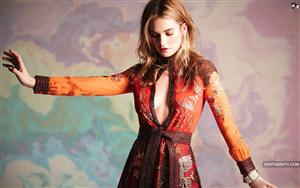 Awe-inspiring Lily James in a sumptuous orange dress